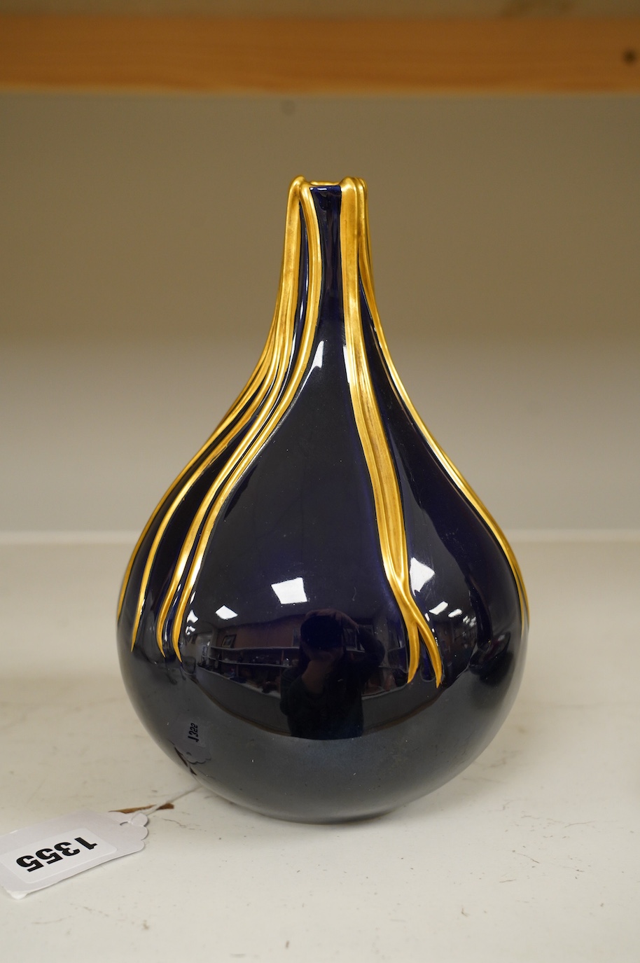 Richard Ginori cobalt blue and gilt bottle vase, mid century, designed by Giovanni Gariboldi, with raised streams of gold running down from the top, numbered 1913E, 21.5cm high. Condition - good